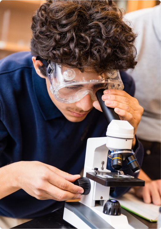 Student using microscope